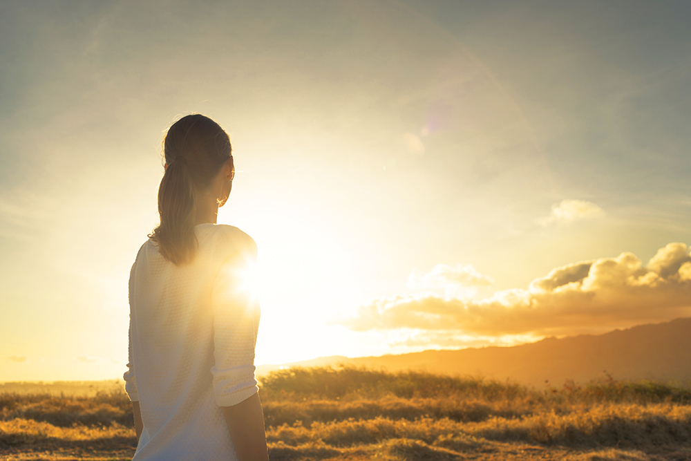 Woman and sunrise